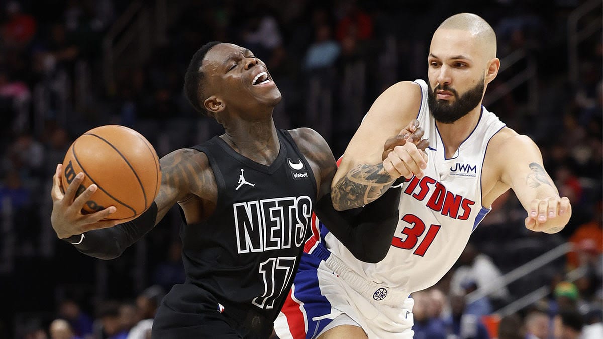 Brooklyn Nets guard Dennis Schroder (17) is fouled by Detroit Pistons guard Evan Fournier (31) in the second half at Little Caesars Arena.