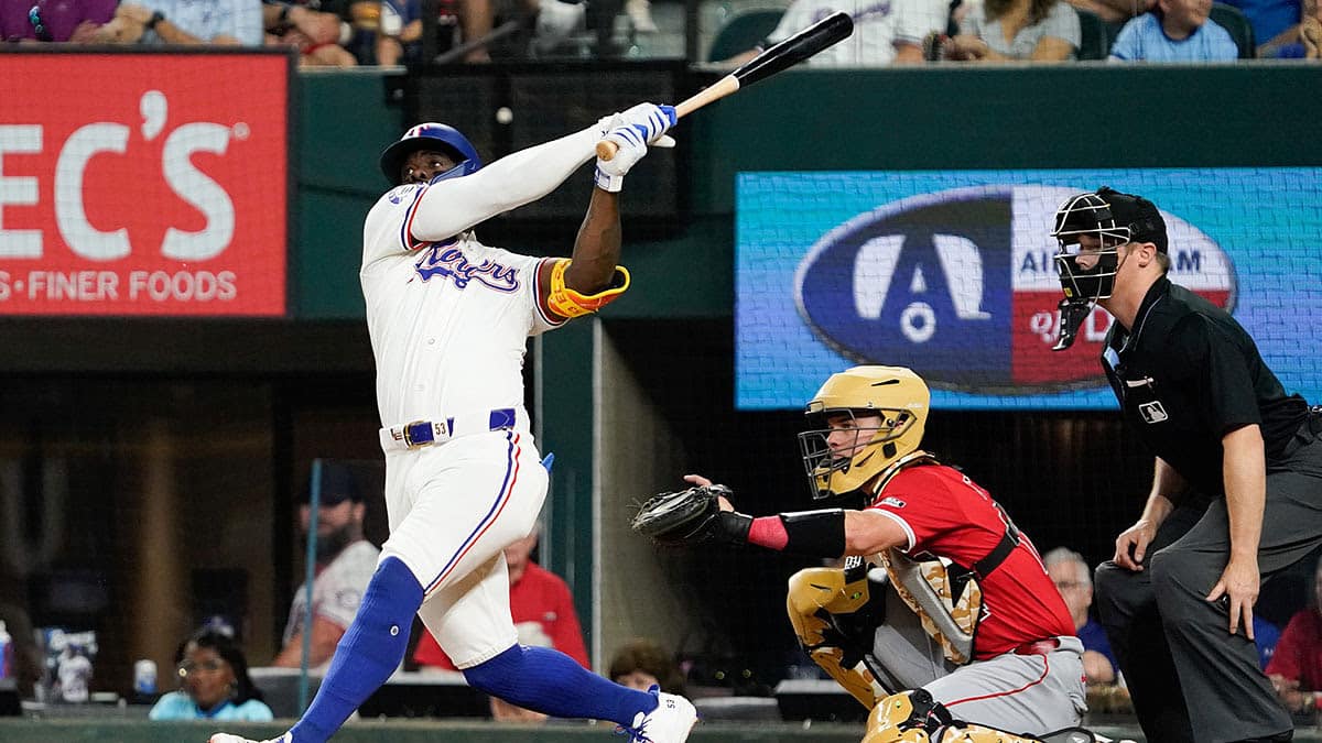 Texas Rangers right fielder Adolis Garcia (53) hits a solo home run during the sixth inning against the Los Angeles Angels at Globe Life Field.