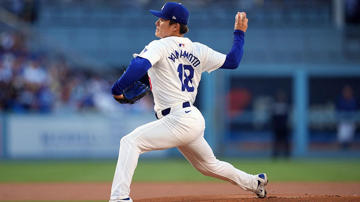 Los Angeles Dodgers starting pitcher Yoshinobu Yamamoto (18) throws in the first inning against the Kansas City Royals at Dodger Stadium.