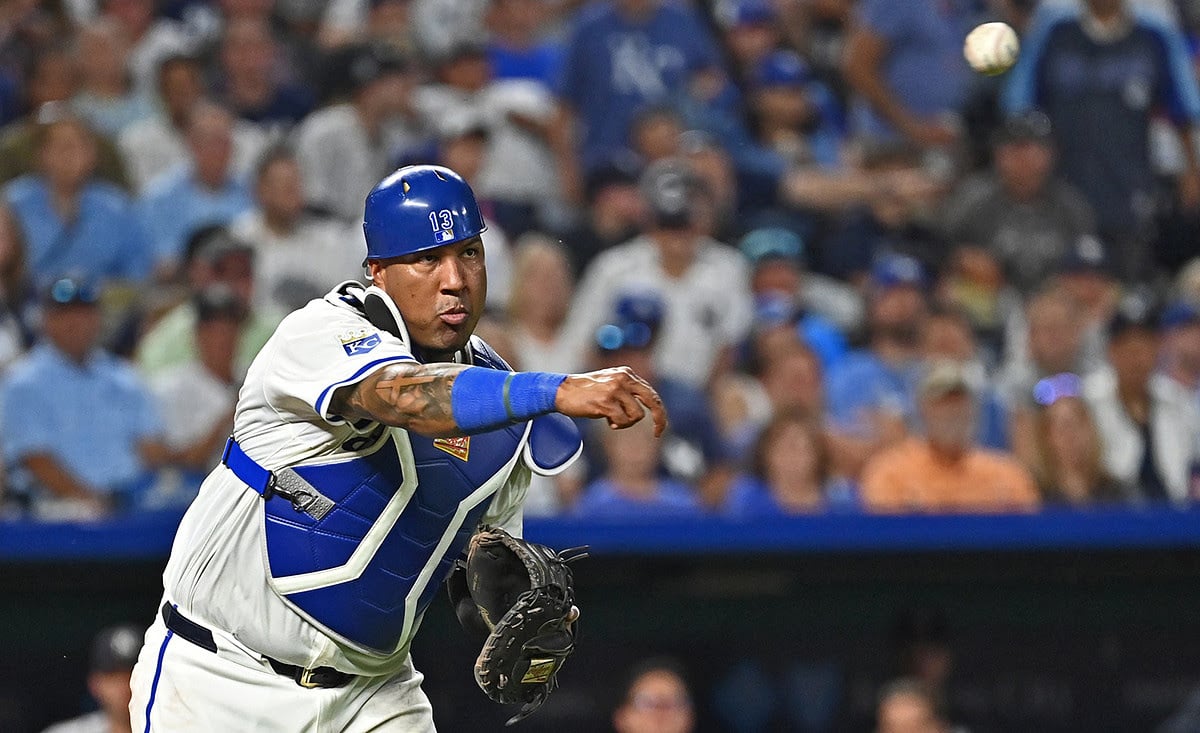 Kansas City Royals catcher Salvador Perez (13) throws the ball to first base for an out in the seventh inning against the New York Yankees at Kauffman Stadium.