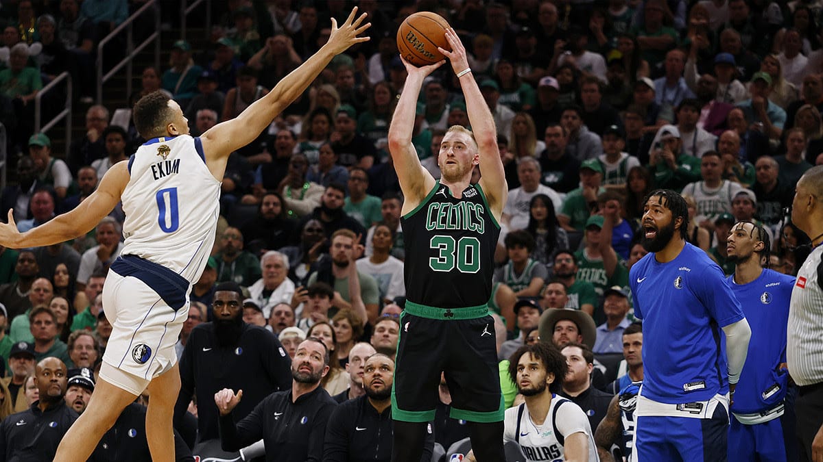 Boston Celtics forward Sam Hauser (30) shoots the ball against Dallas Mavericks guard Dante Exum (0) during the third quarter in game two of the 2024 NBA Finals at TD Garden.