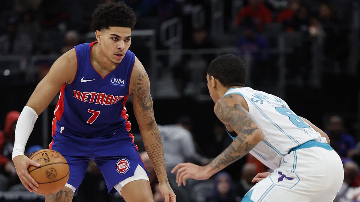 Detroit Pistons guard Killian Hayes (7) dribbles defended by Charlotte Hornets guard Nick Smith Jr. (8) in the first half at Little Caesars Arena.