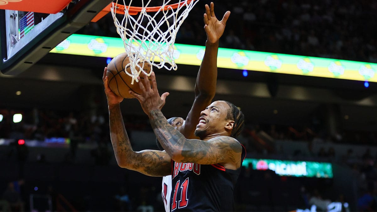 Chicago Bulls forward DeMar DeRozan (11) drives to the basket against Miami Heat center Bam Adebayo (13) in the second quarter during a play-in game of the 2024 NBA playoffs at Kaseya Center.