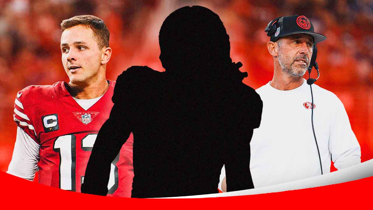 1 Mystery player in the middle, Brock Purdy and coach Kyle Shanahan around him, San Francisco 49ers wallpaper in the background