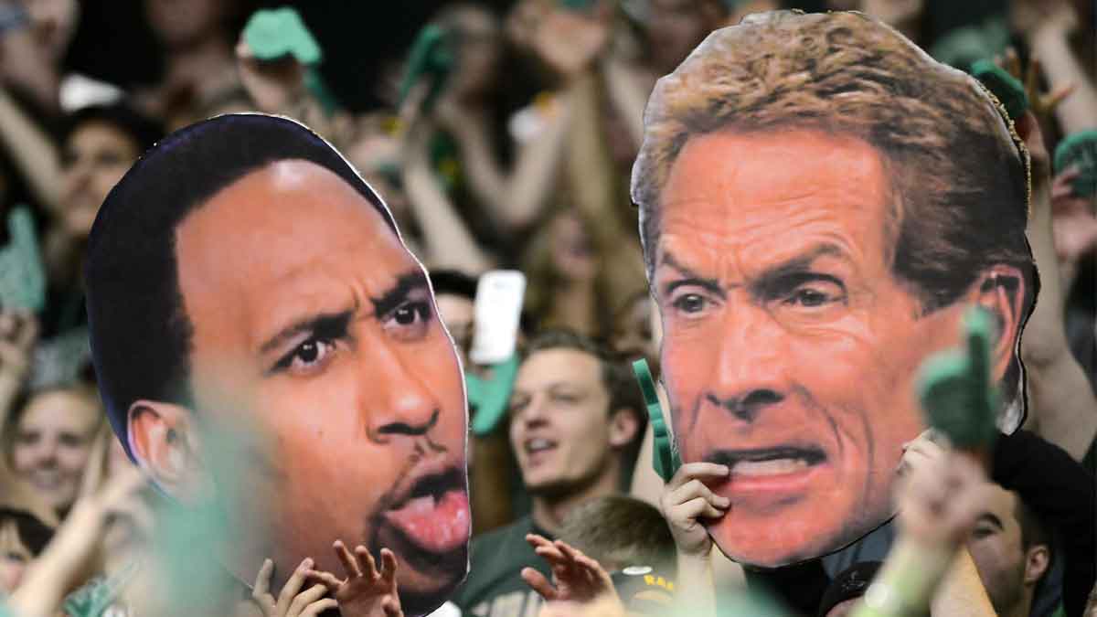 Colorado State Rams fans hold large cut outs of ESPN television personality Stephen A. Smith (left) and Skip Bayless (right) during the game against the New Mexico Lobos at Moby Arena. The Lobos defeated the Rams 91-82.