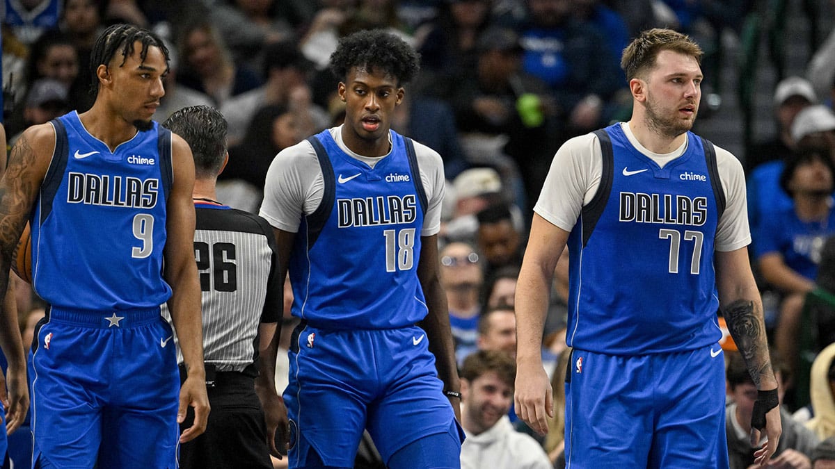Dallas Mavericks guard A.J. Lawson (9) and forward Olivier-Maxence Prosper (18) and guard Luka Doncic (77) in action during the game between the Dallas Mavericks and the Oklahoma City Thunder at the American Airlines Center.