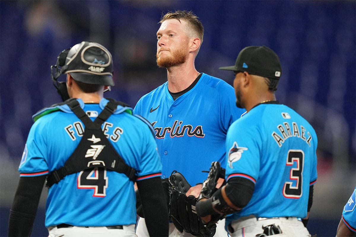 Miami Marlins starting pitcher A.J. Puk (35) gets a visit to the mound from pitching coach Mel Stottlemyre in the first inning against the Los Angeles Angels at loanDepot Park. 