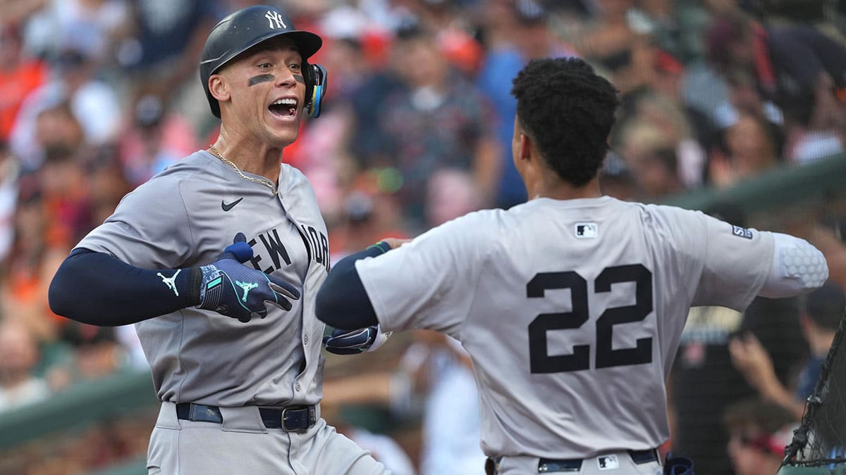 New York Yankees outfielder Aaron Judge (99) greeted by outfielder Juan Soto (22) following his solo home run in the fifth inning against the Baltimore Orioles at Oriole Park at Camden Yards.
