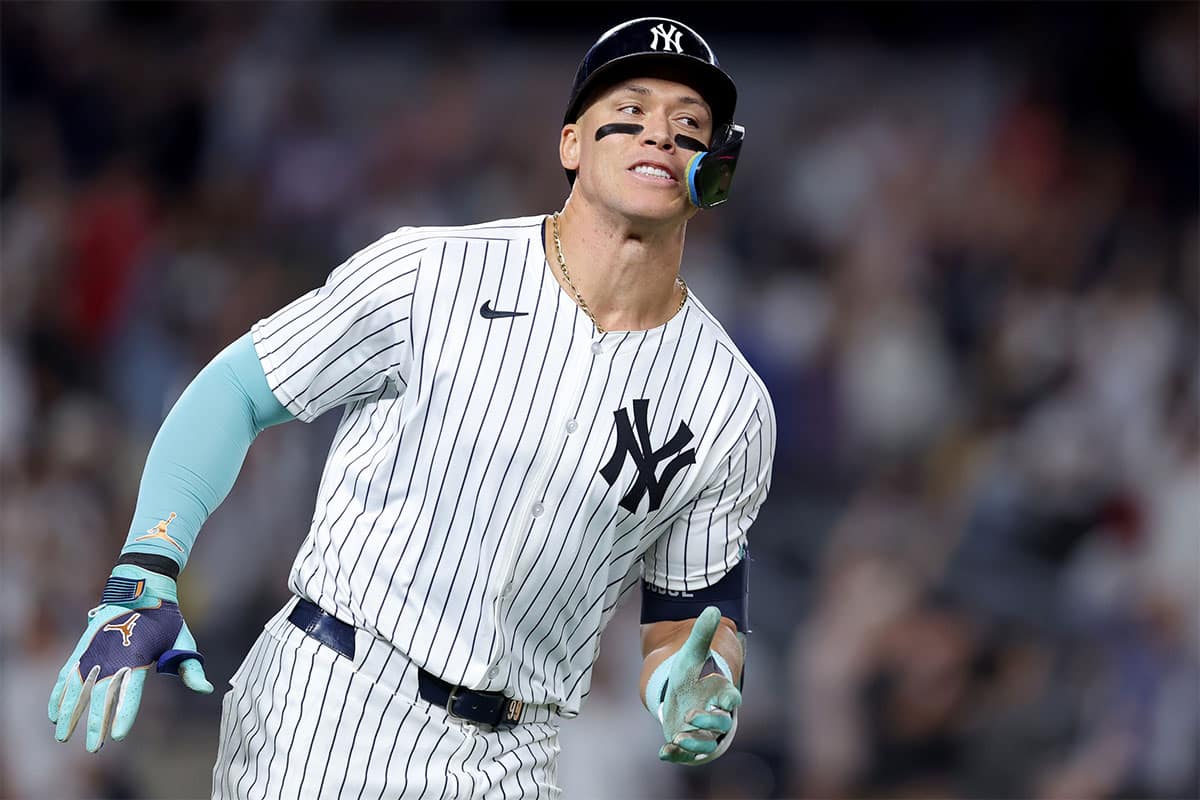 New York Yankees designated hitter Aaron Judge (99) rounds the bases after hitting a solo home run against the Cincinnati Reds during the seventh inning at Yankee Stadium.