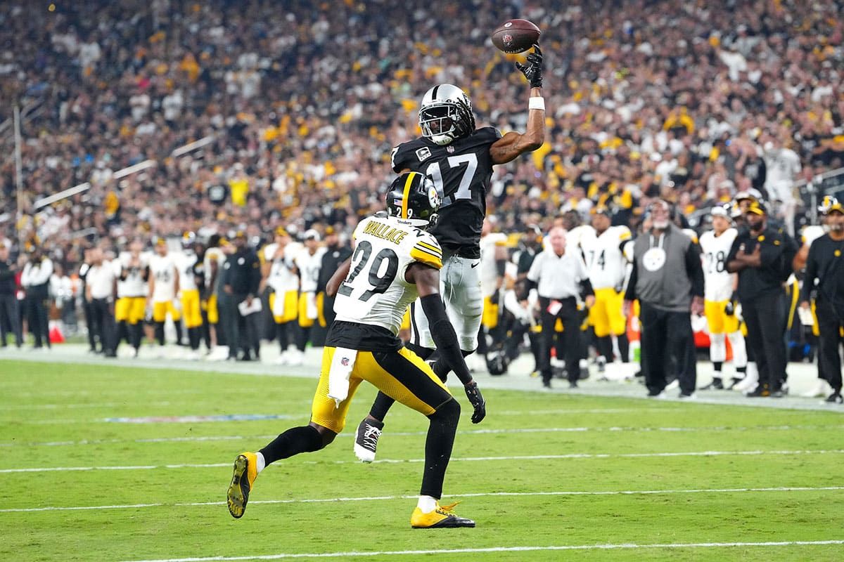 Las Vegas Raiders wide receiver Davante Adams (17) misses a pass attempt as Pittsburgh Steelers cornerback Levi Wallace (29) defends during the fourth quarter at Allegiant Stadium.