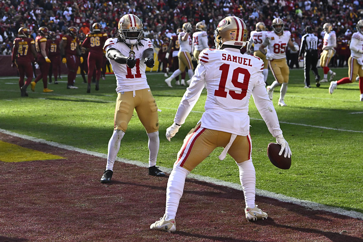 San Francisco 49ers wide receiver Deebo Samuel (19) celebrates with wide receiver Brandon Aiyuk (11) after scoring a touchdown against the Washington Commanders during the first half at FedExField.