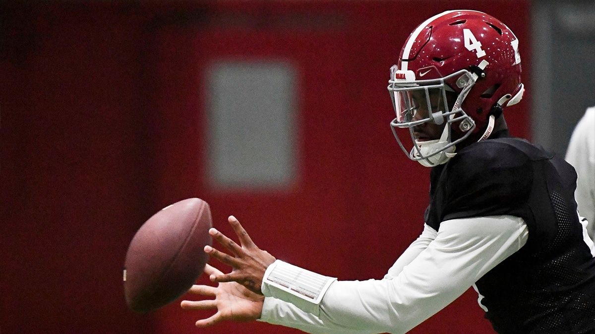 April 9, 2024; Tuscaloosa, Alabama, USA; Alabama quarterback Jalen Milroe (4) takes a snap during practice in the Hank Crisp Indoor Practice Facility at the University of Alabama.