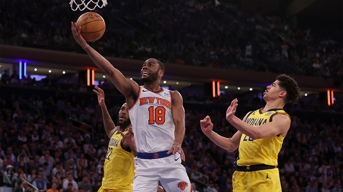 New York Knicks guard Alec Burks (18) drives to the basket against Indiana Pacers forward Isaiah Jackson (22) and guard Ben Sheppard (26) during the fourth quarter of game seven of the second round of the 2024 NBA playoffs at Madison Square Garden.