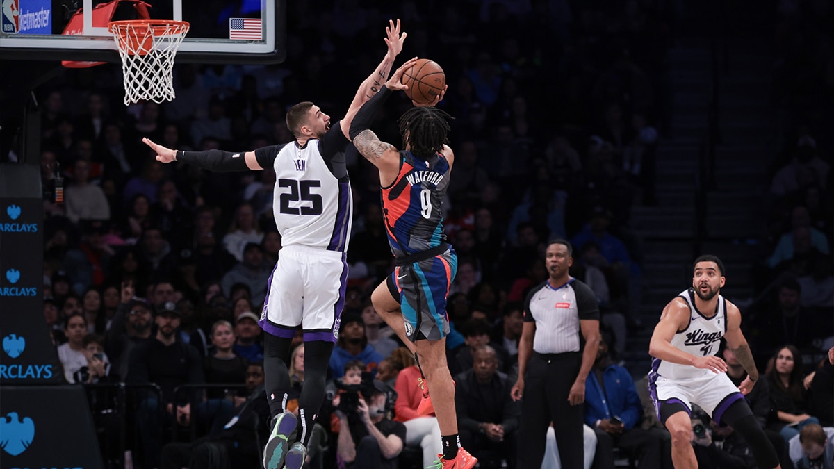 Apr 7, 2024; Brooklyn, New York, USA; Brooklyn Nets forward Trendon Watford (9) shoots the ball against Sacramento Kings center Alex Len (25) during the first half at Barclays Center. Mandatory Credit: Vincent Carchietta-USA TODAY Sports