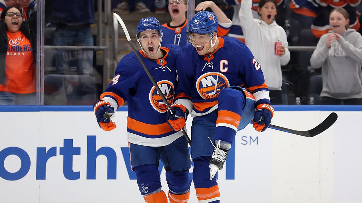  New York Islanders left wing Anders Lee (27) celebrates his goal against the Boston Bruins with center Jean-Gabriel Pageau (44) during the second period at UBS Arena.