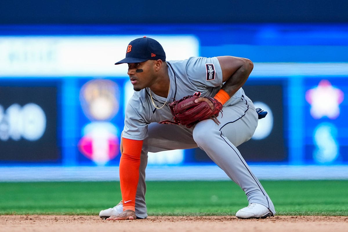 Detroit Tigers second base Andy Ibanez (77) touches the dirt at an MLB game against the Toronto Blue Jays at Rogers Centre.