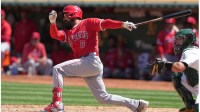 Los Angeles Angels third baseman Anthony Rendon (6) hits a single against the Oakland Athletics during the seventh inning at Oakland-Alameda County Coliseum.