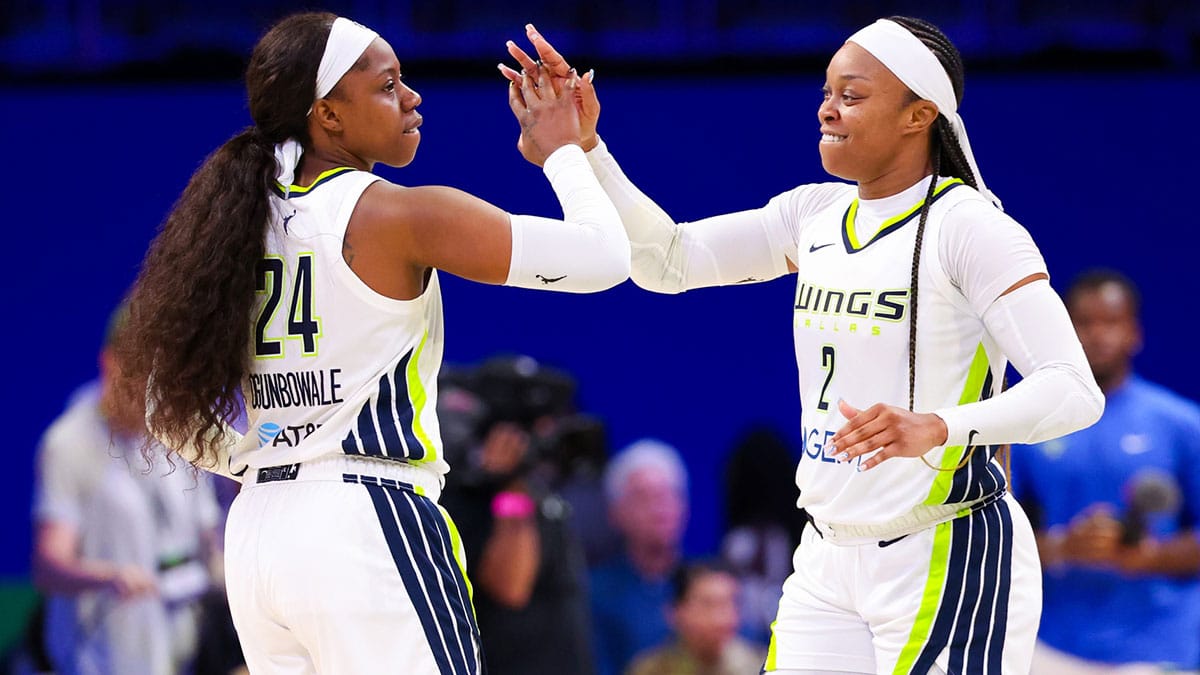 Dallas Wings guard Arike Ogunbowale (24) celebrates with Dallas Wings guard Odyssey Sims (2) after the game against the Indiana Fever at College Park Center. 