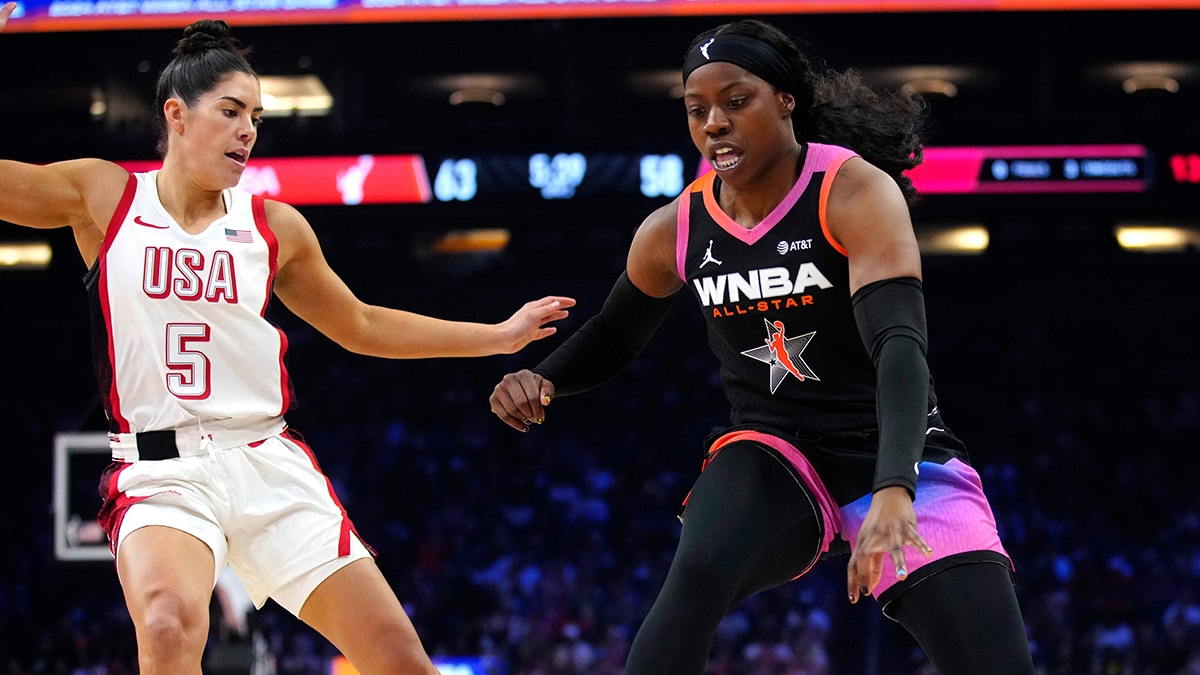 WNBA Team guard Arike Ogunbowale drives against USA Team guard Kelsey Plum during the WNBA All-Star Game.
