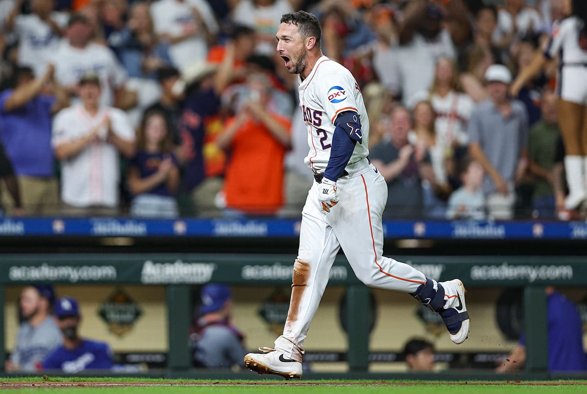 Houston Astros third baseman Alex Bregman (2) runs towards home plate after hitting a walk-off home run during the ninth inning against the Los Angeles Dodgers at Minute Maid Park. 