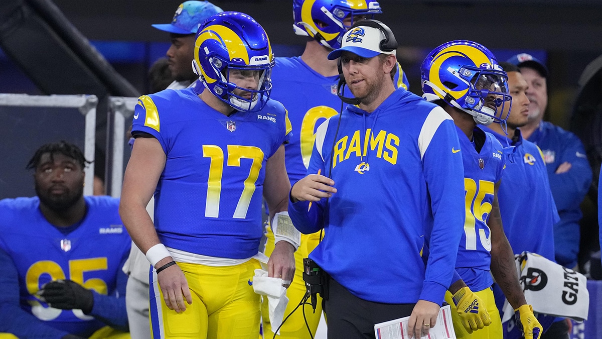 Los Angeles Rams quarterback Baker Mayfield (17) talks with offensive coordinator Liam Coen against the Las Vegas Raiders in the first half at SoFi Stadium.