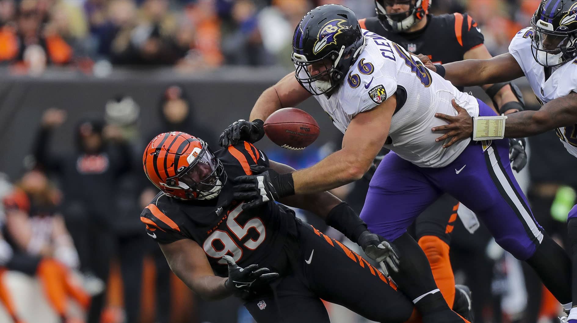 Cincinnati Bengals defensive tackle Zach Carter (95) attempts to catch the tipped ball against Baltimore Ravens guard Ben Cleveland (66) in the second half at Paycor Stadium. 