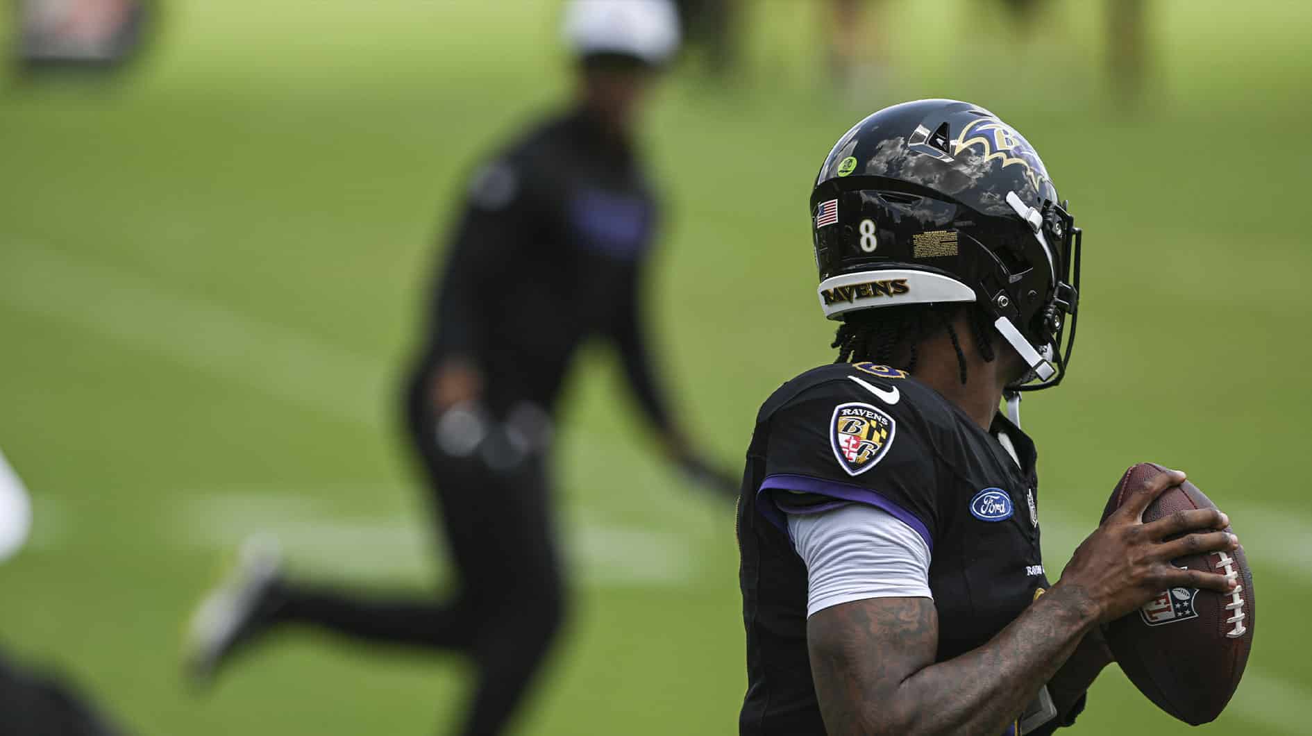Jul 27, 2024; Owings Mill , MD, USA; Baltimore Ravens quarterback Lamar Jackson looks to pass during the afternoon session of training camp at the Under Armour Performance Center, Mandatory Credit: Tommy Gilligan-USA TODAY Sports