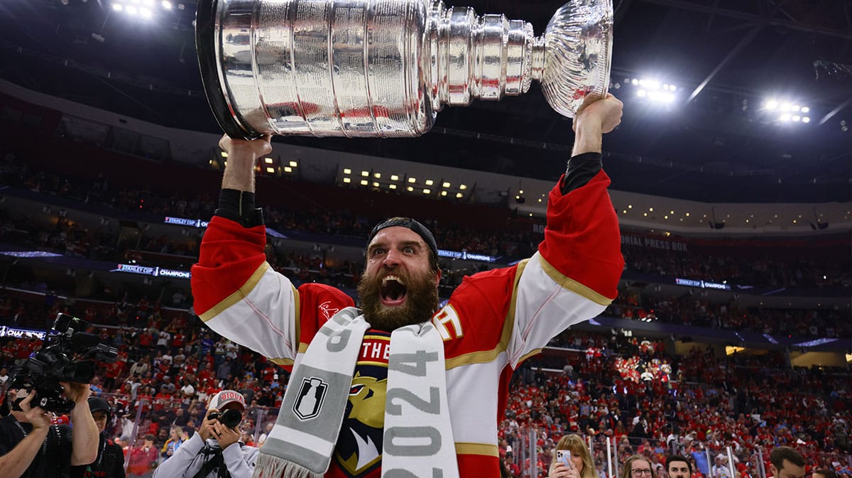 Florida Panthers defenseman Aaron Ekblad (5) hoists the Stanley Cup after defeating Edmonton Oilers in game seven of the 2024 Stanley Cup Final at Amerant Bank Arena.
