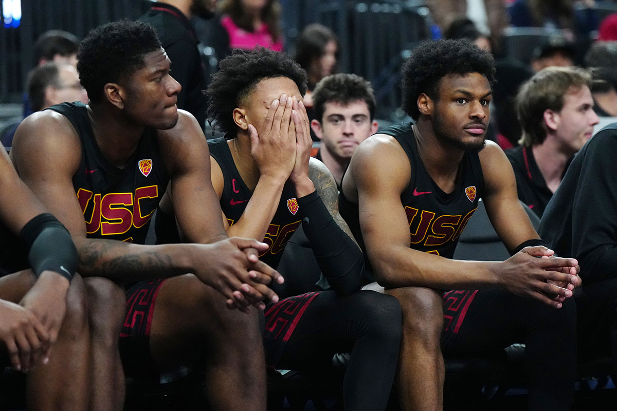 Southern California Trojans forward Kijani Wright (left), guard Boogie Ellis (center) and guard Bronny James (6) react against the Arizona Wildcats in the second half at T-Mobile Arena.