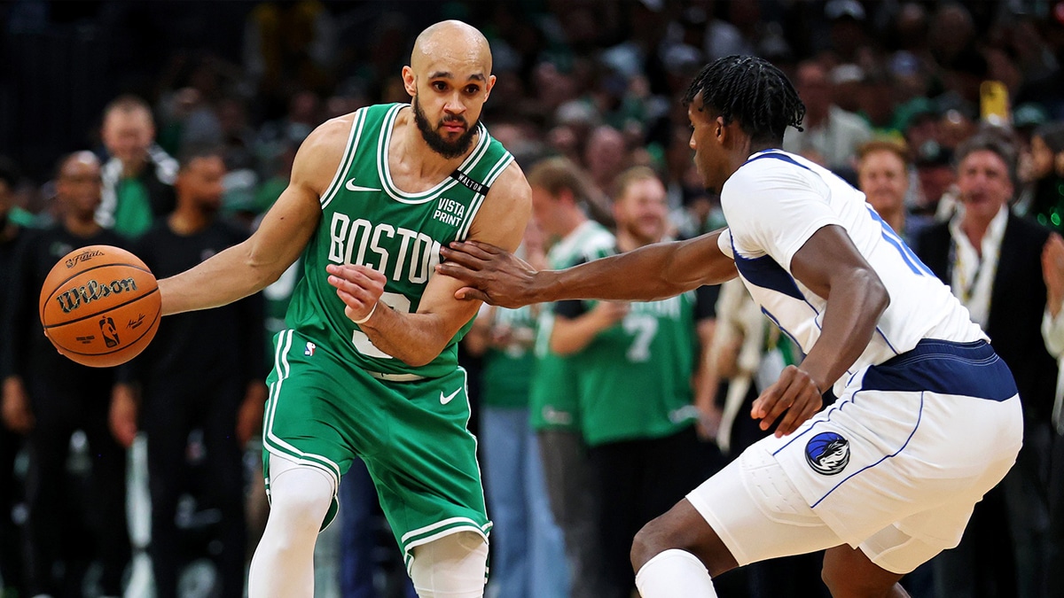 Jun 17, 2024; Boston, Massachusetts, USA; Boston Celtics guard Derrick White (9) handles the ball against the Dallas Mavericks in game five of the 2024 NBA Finals at TD Garden. Mandatory Credit: Peter Casey-USA TODAY Sports