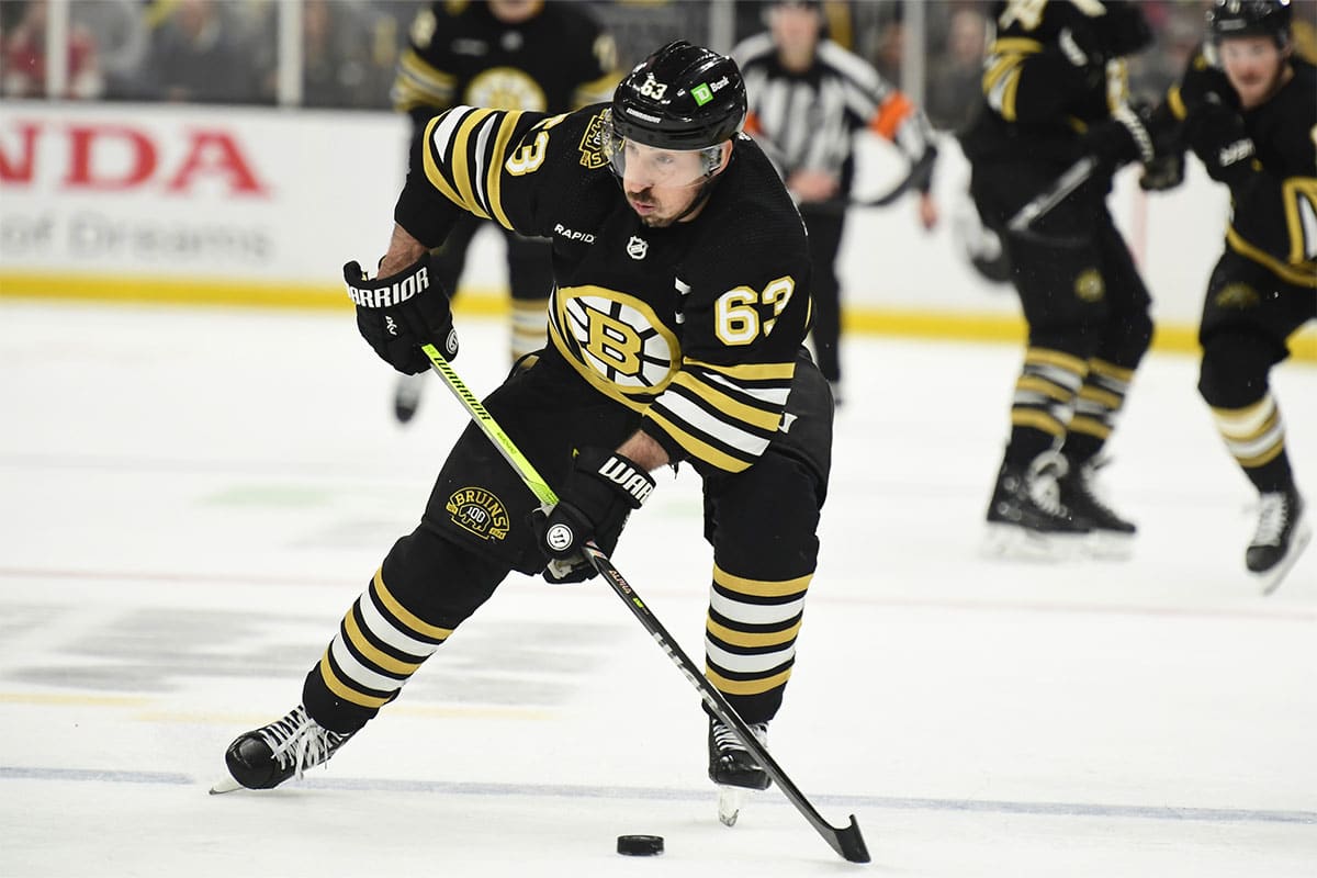  Boston Bruins left wing Brad Marchand (63) controls the puck during the third period in game six of the second round of the 2024 Stanley Cup Playoffs against the Florida Panthers at TD Garden.