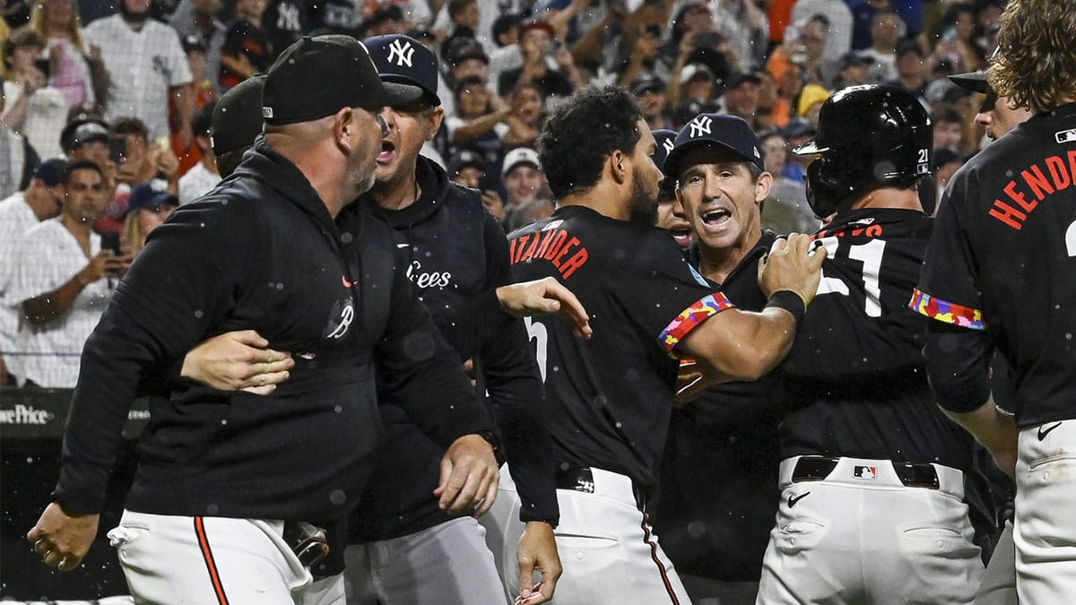 New York Yankees bench coach Brad Ausmus (68) and Baltimore Orioles manager Brandon Hyde (18) exchange words during the ninth inning at Oriole Park at Camden Yards