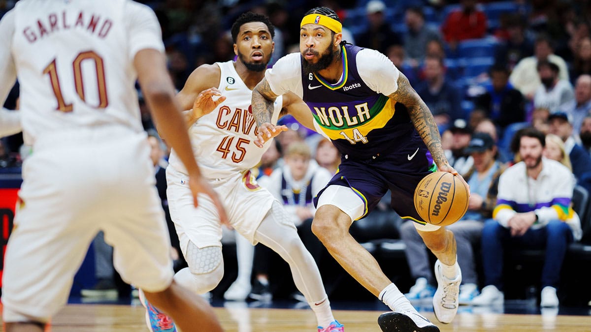 New Orleans Pelicans forward Brandon Ingram (14) drives to the basket against Cleveland Cavaliers guard Donovan Mitchell (45) during the third quarter at Smoothie King Center.
