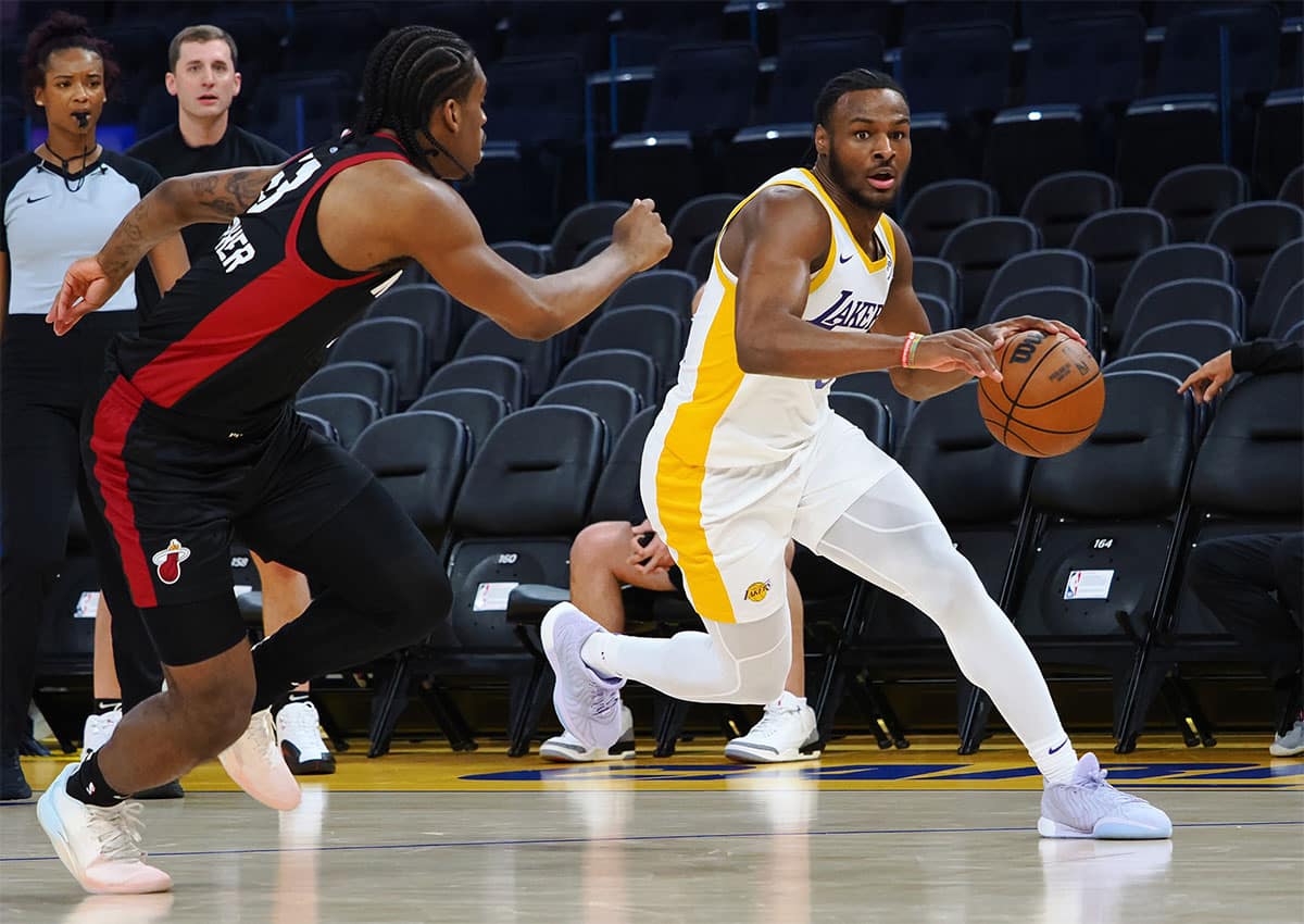 Los Angeles Lakers guard Bronny James Jr. (9) controls the ball against Miami Heat guard Josh Christopher (53) during the fourth quarter at Chase Center.