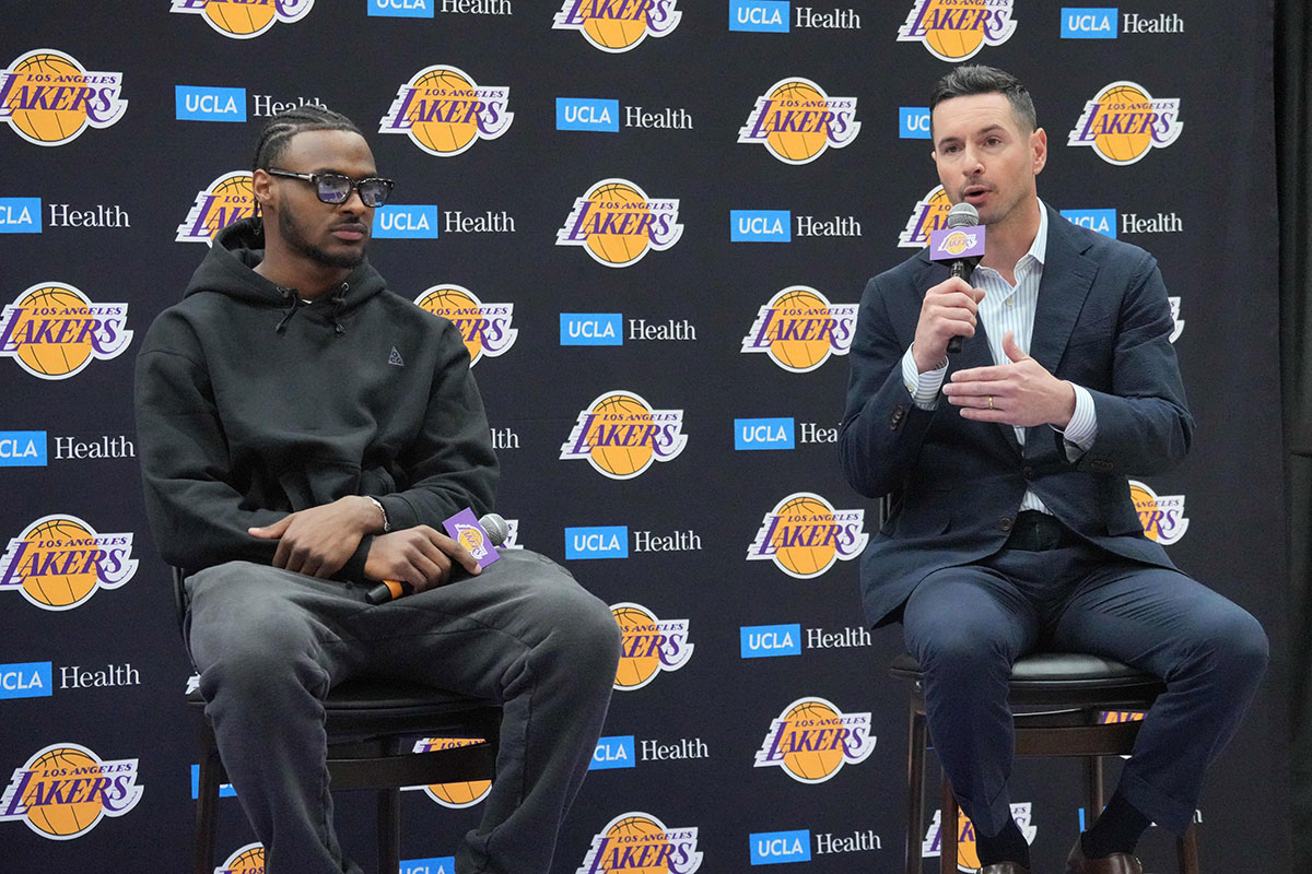  Los Angeles Lakers coach JJ Redick (right) and second-round draft pick Bronny James at a press conference at the UCLA Health Training Center.