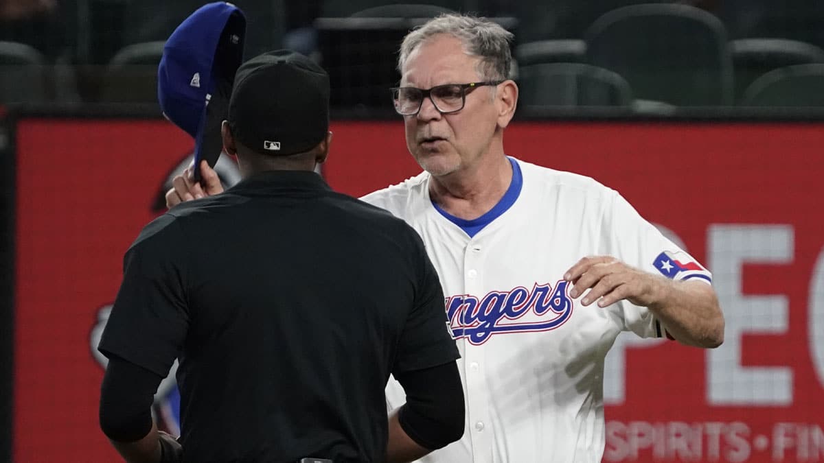 Texas Rangers manager Bruce Bochy (15) has words with home plate umpire Edwin Moscoso after being ejected during the fifth inning against the Chicago White Sox at Globe Life Field.