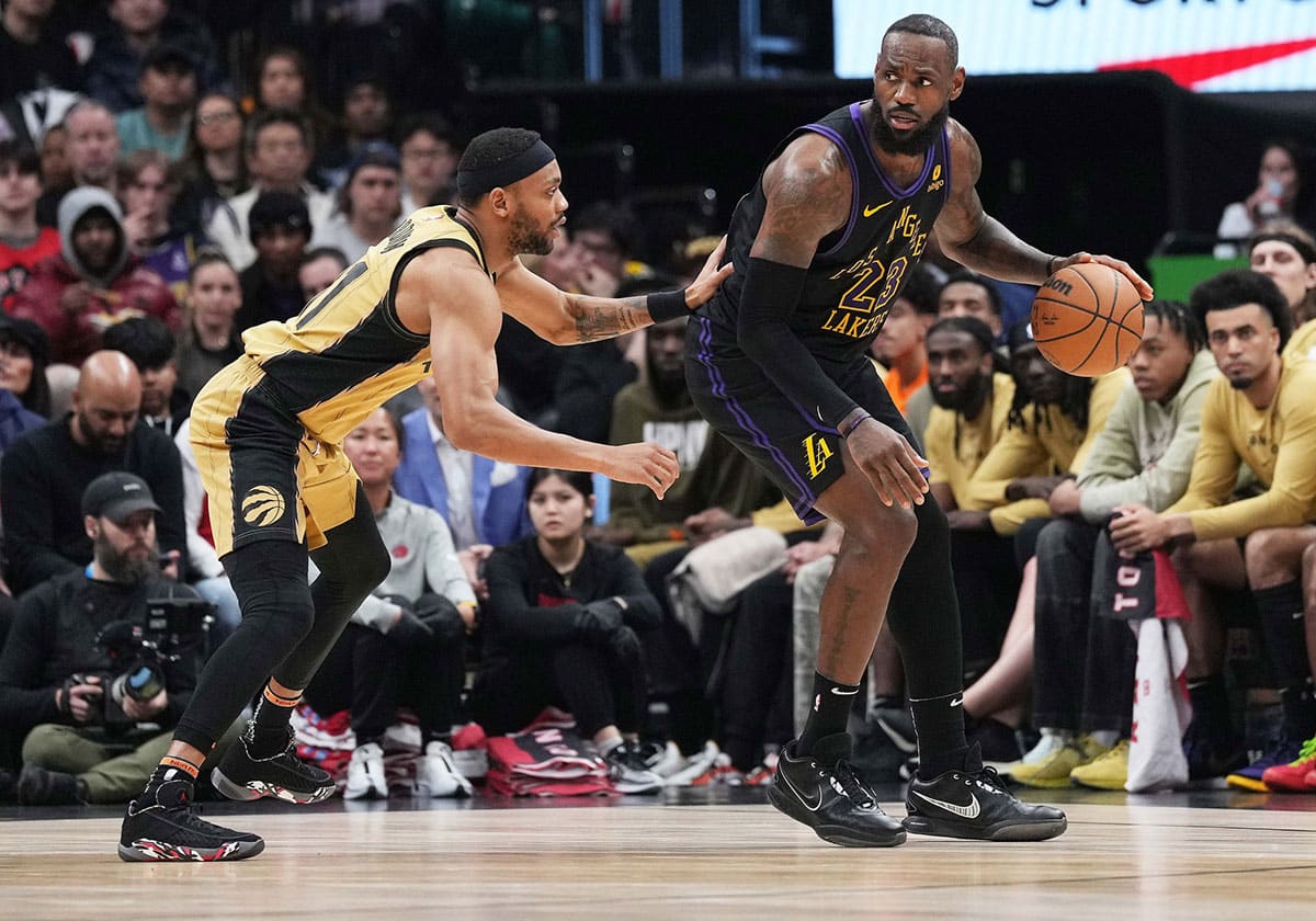 Los Angeles Lakers forward LeBron James (23) controls the ball as Toronto Raptors forward Bruce Brown (11) tries to defend during the third quarter at Scotiabank Arena. 