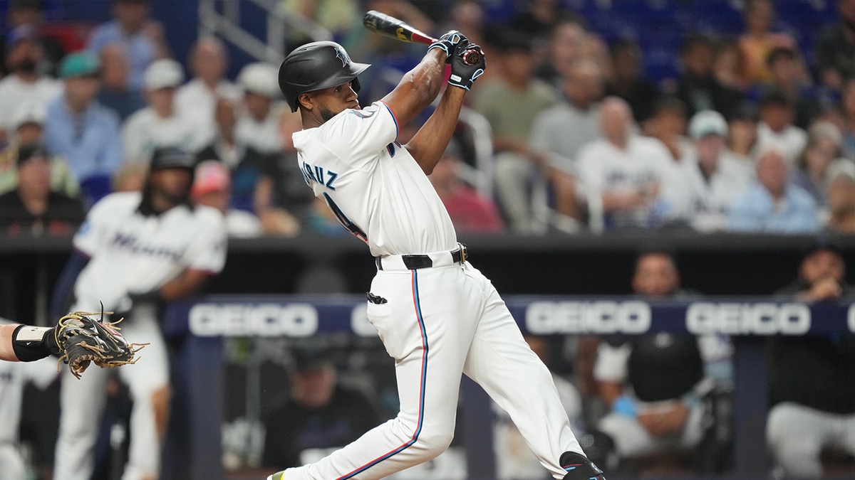Miami Marlins right fielder Bryan De La Cruz (14) hits a RBI single in the seventh inning against the Baltimore Orioles at loanDepot Park. 