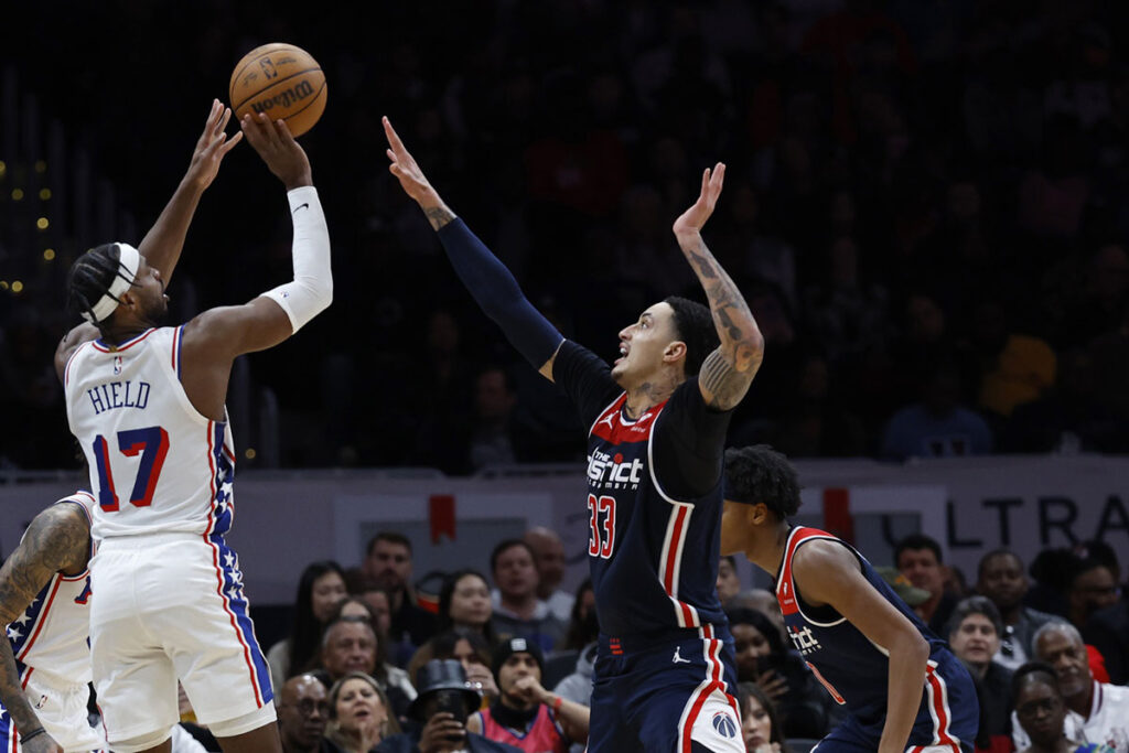 Philadelphia 76ers guard Buddy Hield (17) shoots the ball over Washington Wizards forward Kyle Kuzma (33) in the second half at Capital One Arena