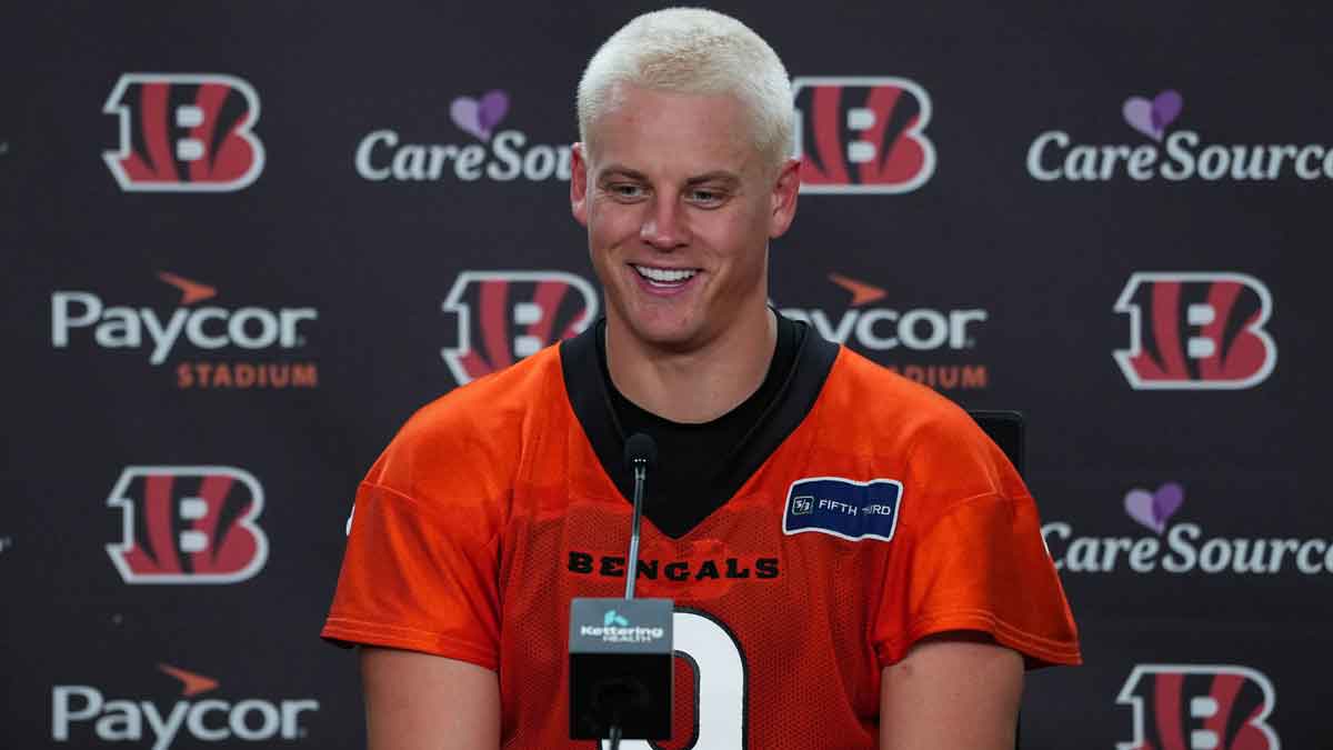 Joe Burrow at a presser with a new hairstyle. 