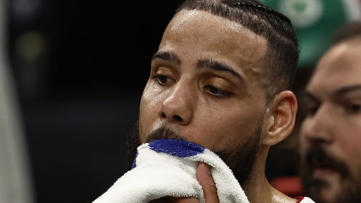 Miami Heat forward Caleb Martin (16) wipes sweat from his face during the fourth quarter of game five of the first round of the 2024 NBA playoffs against the Boston Celtics at TD Garden.