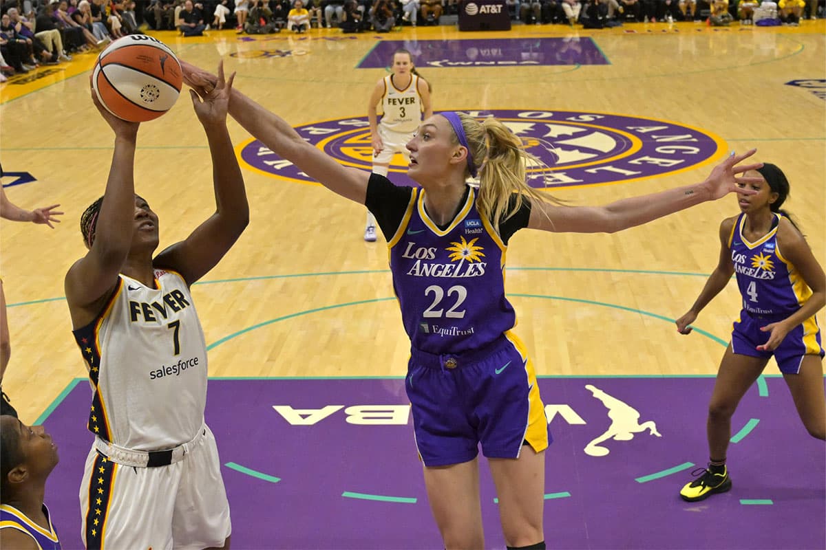 Los Angeles Sparks forward Cameron Brink (22) blocks a shot by Indiana Fever forward Aliyah Boston (7) in the first half at Crypto.com Arena.