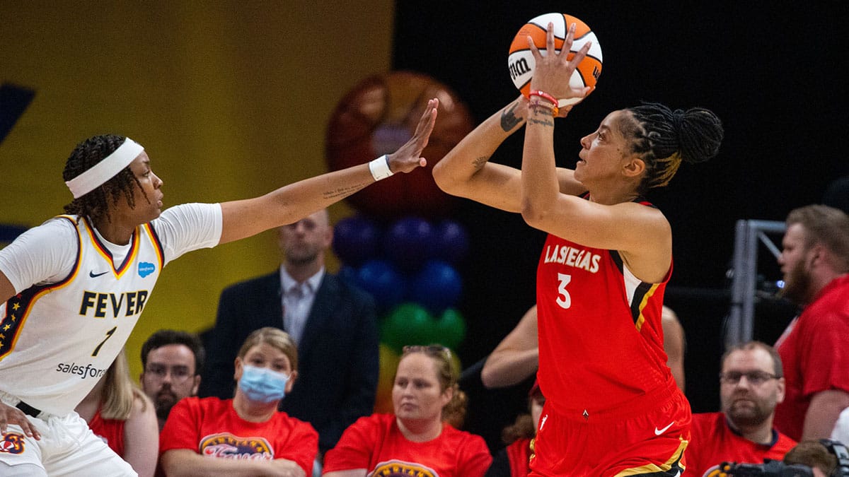 Las Vegas Aces forward Candace Parker (3) shoots the ball while Indiana Fever forward NaLyssa Smith (1) defends in the first half at Gainbridge Fieldhouse.