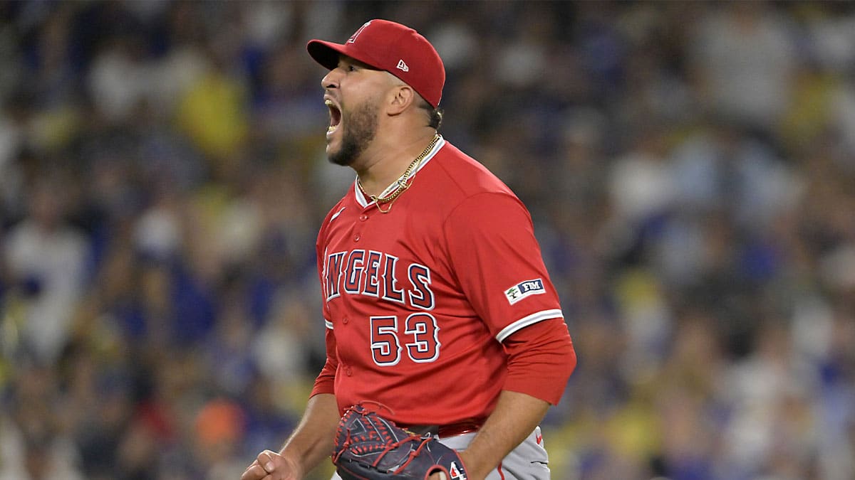 Los Angeles Angels relief pitcher Carlos Estevez (53) reacts after striking out Los Angeles Dodgers second baseman Gavin Lux (9) in the 10th inning earning a save in the game at Dodger Stadium.