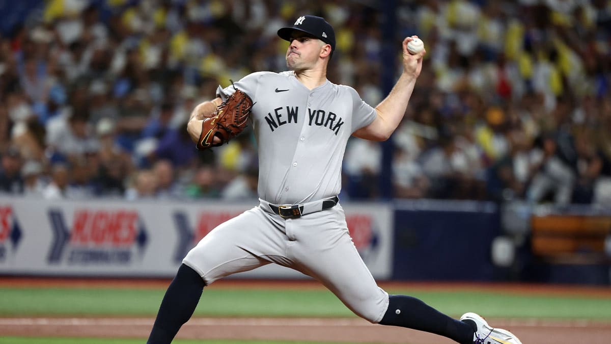 New York Yankees starting pitcher Carlos Rodon (55) throws a pitch against the Tampa Bay Rays during the first inning at Tropicana Field. 