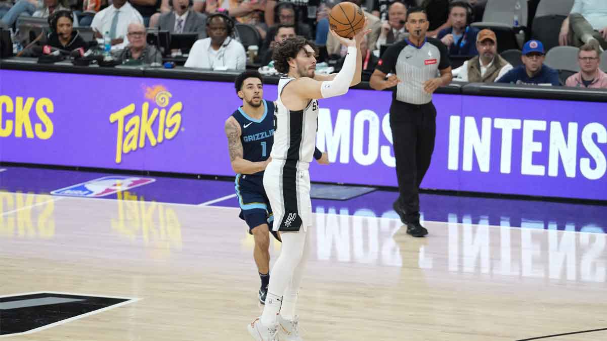 San Antonio Spurs forward Cedi Osman (16) shoots in front of Memphis Grizzlies guard Scotty Pippen Jr. (1) in the first half at Frost Bank Center