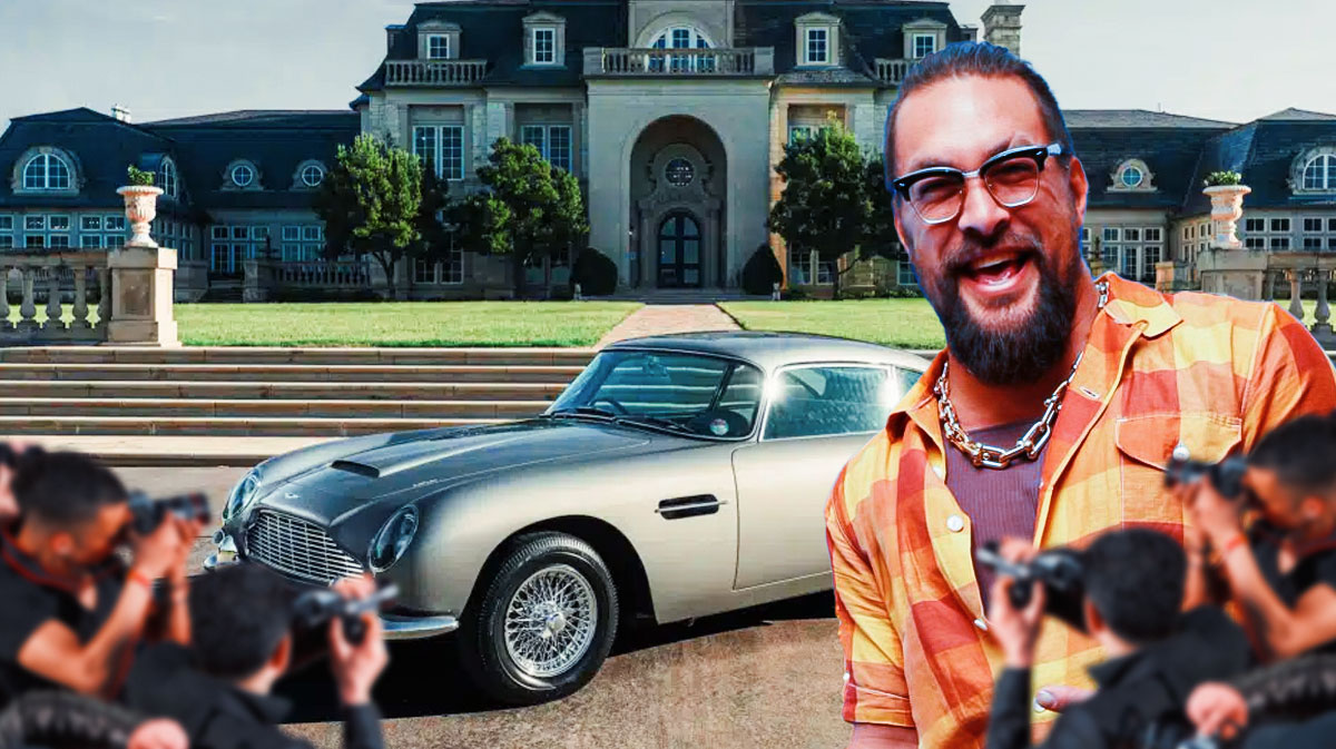 Jason Momoa in front of a car from his collection.
