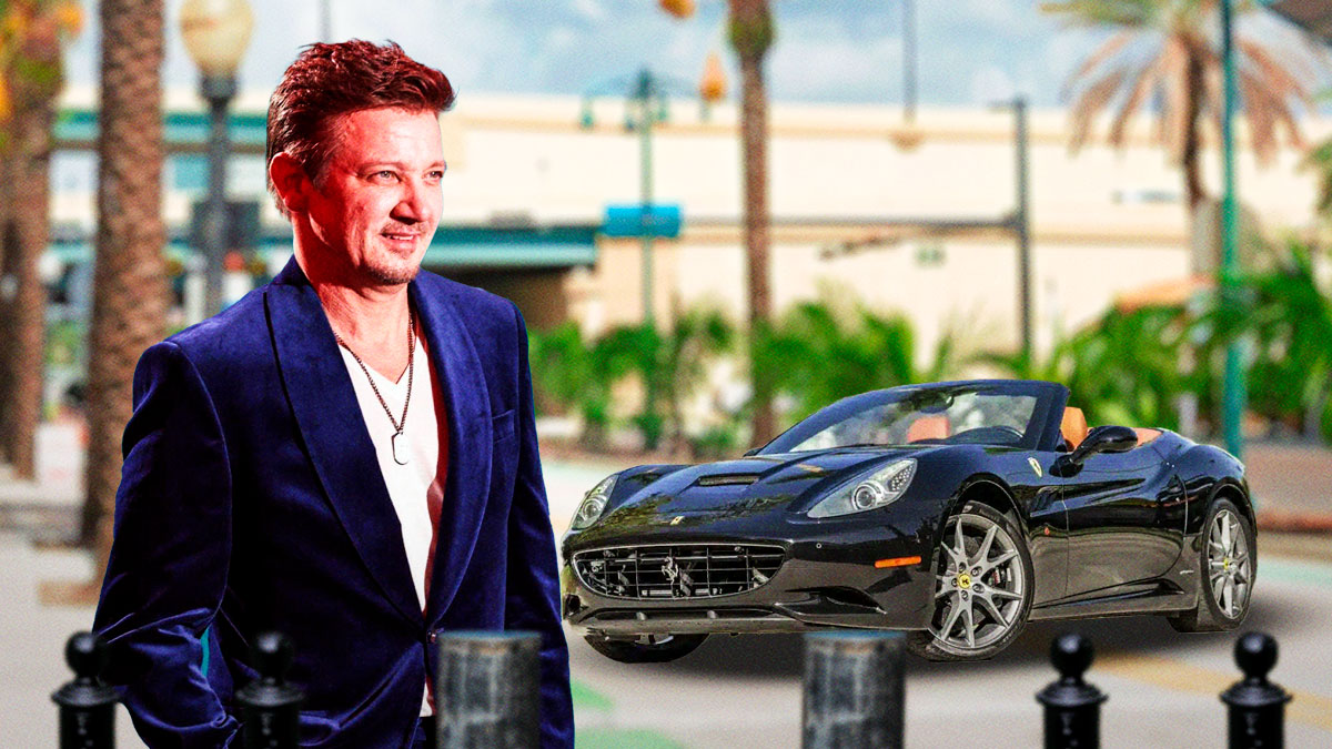 Jeremy Renner in front of a car from his collection.