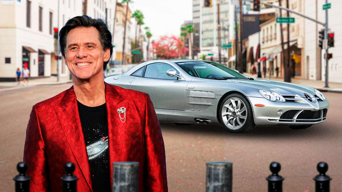 Jim Carrey in front of a car from his collection.