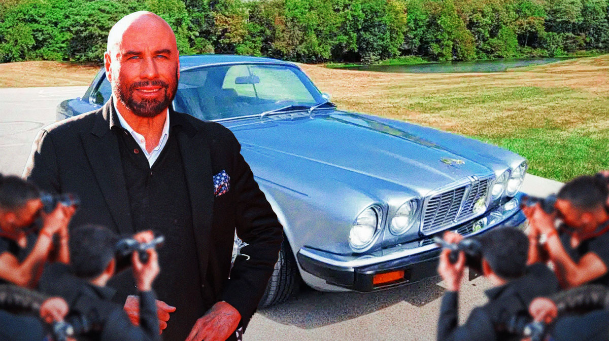 John Travolta in front of a car from his collection.